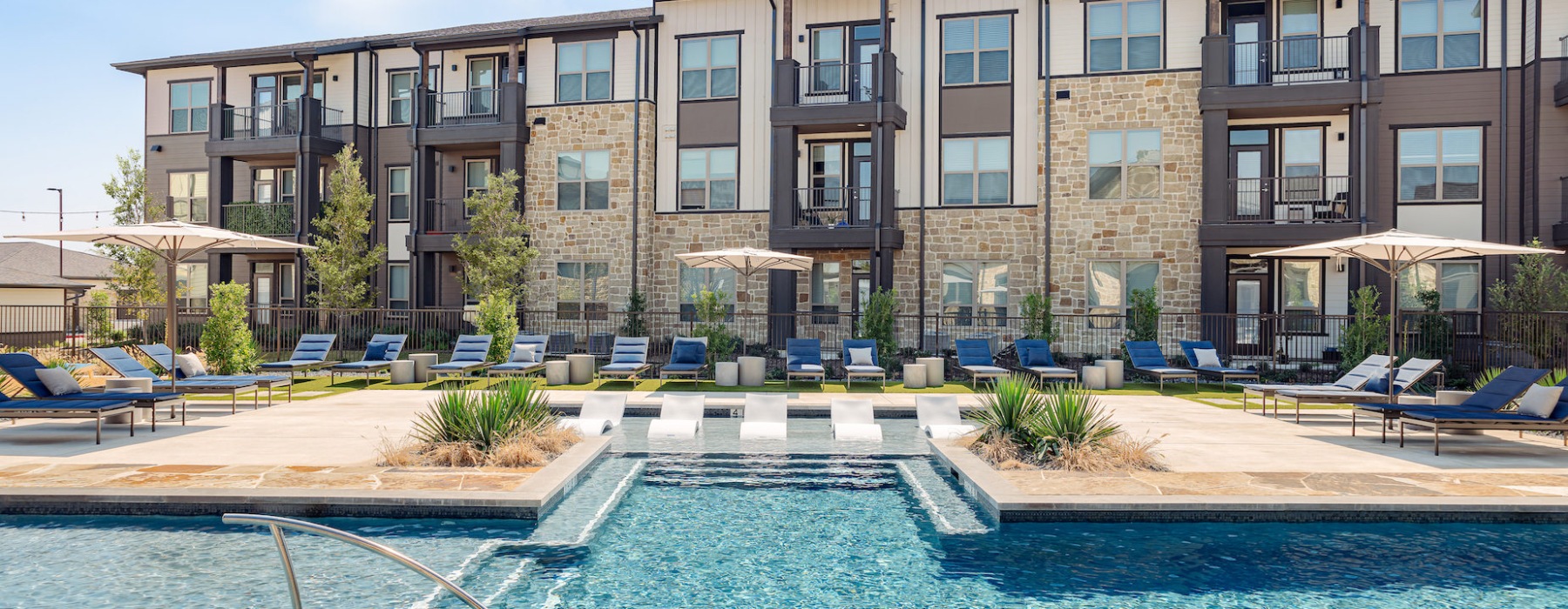 Sparkling swimming pool with Lush Landscaping